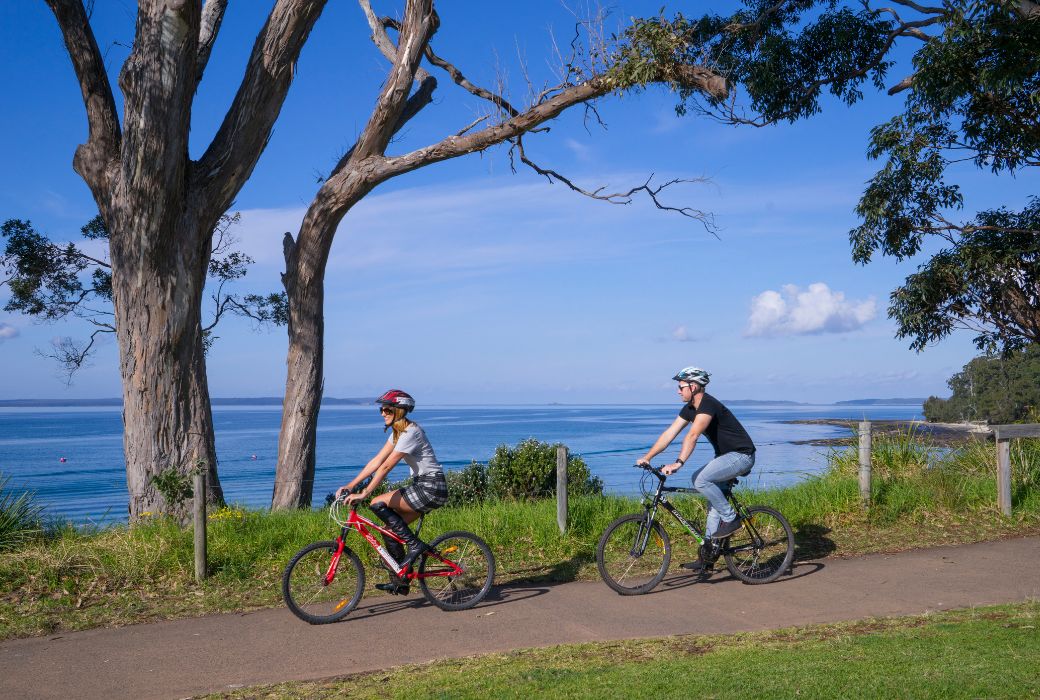 Couple cycling at Jervis Bay, Shoalhaven