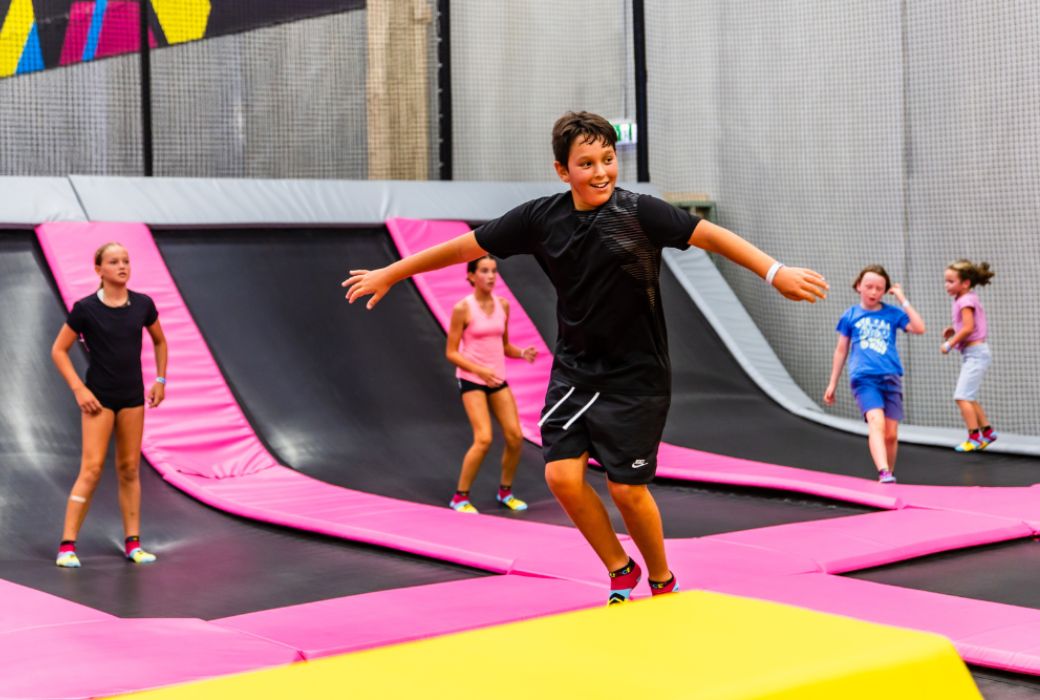 Young boy bouncing on trampoline