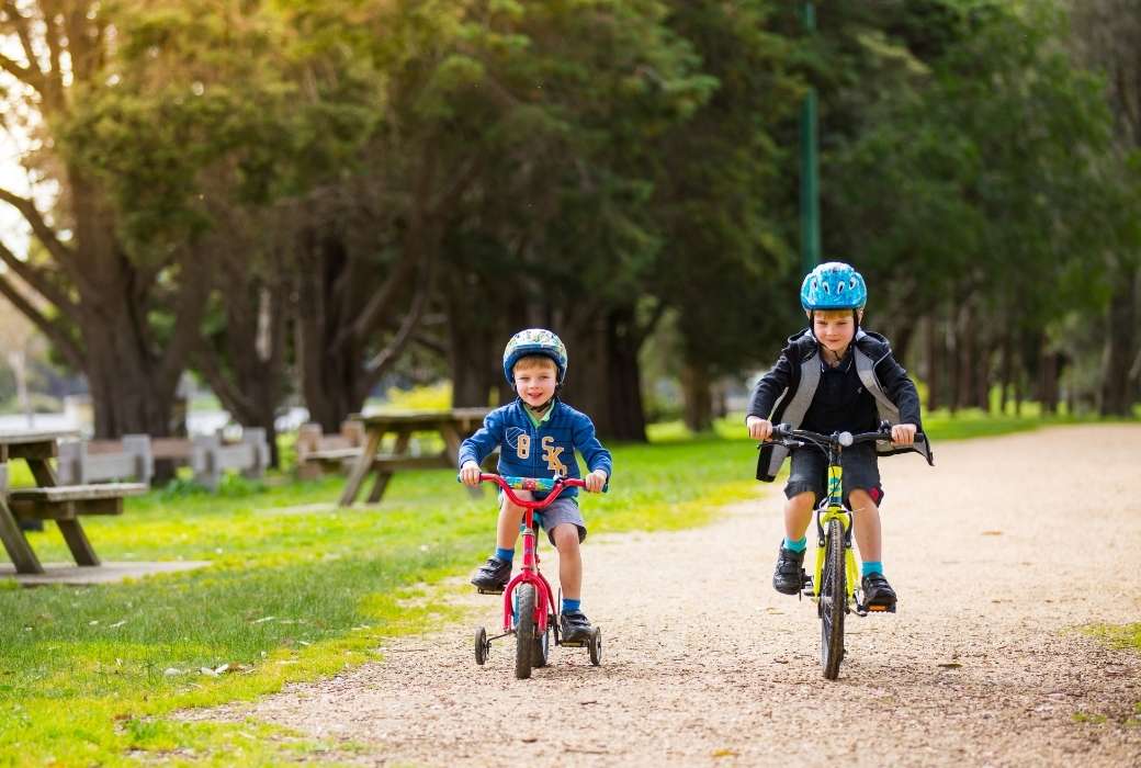 two boys riding bikes along the Barwon River, Geelong