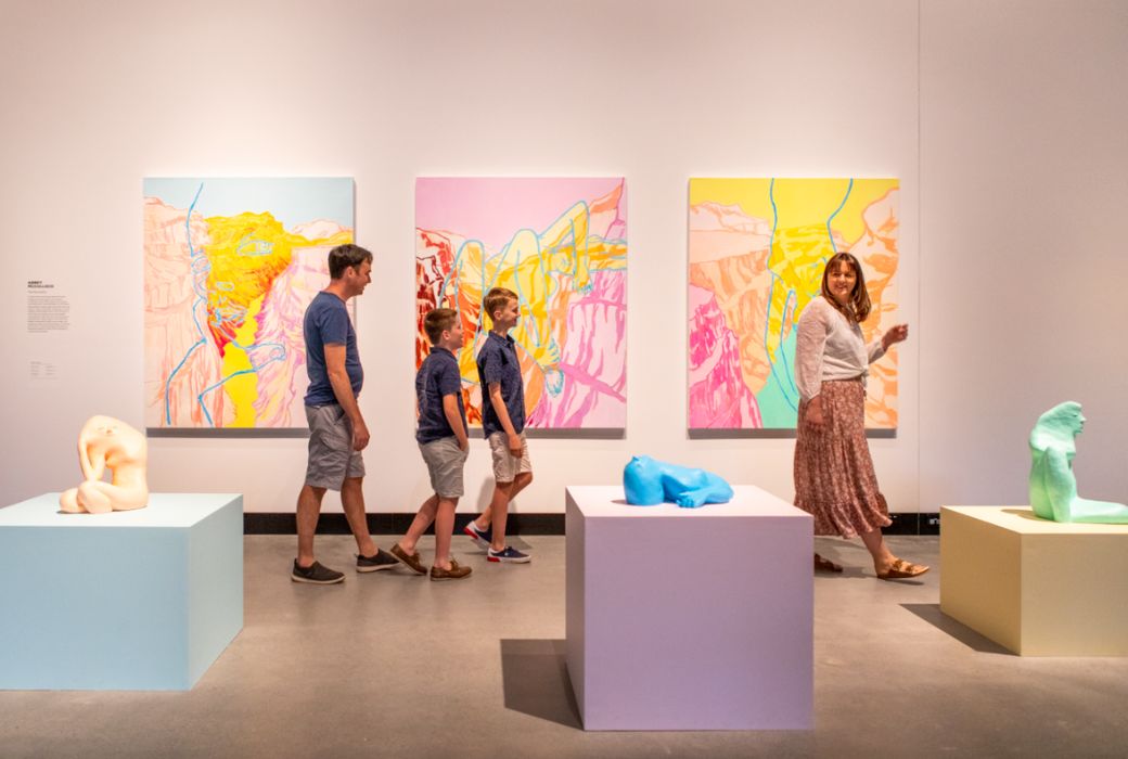 Family walking through art gallery