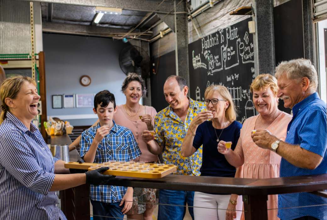 People doing a tasting at the Sarina Sugar Shed