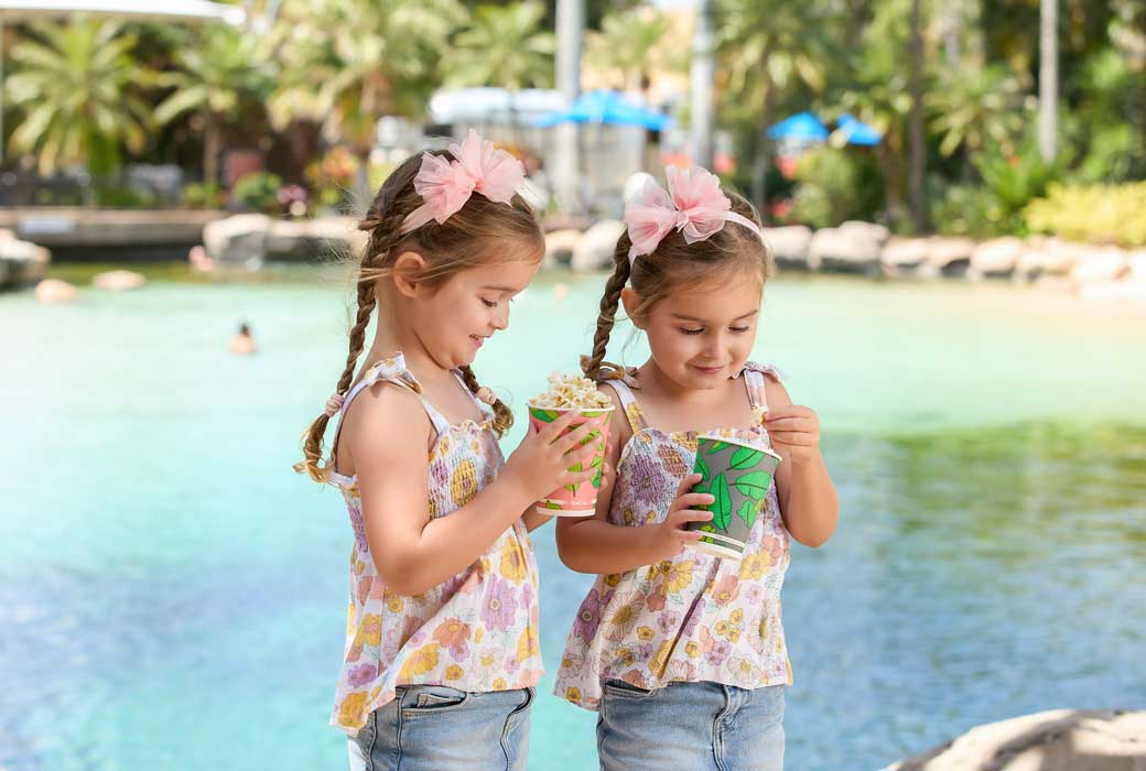 Girls eating popcorn at JW Marriott Gold Coast pool