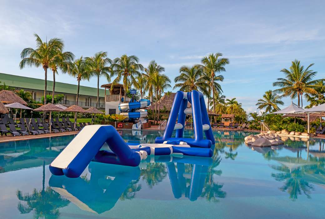 Pool and waterslide at OUTRIGGER Fiji Beach Resort