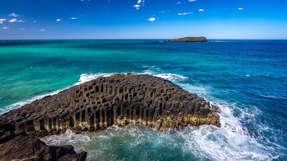 Basalt volcanic rock columns nature formations at the Fingal Head Causeway, NSW, Australia