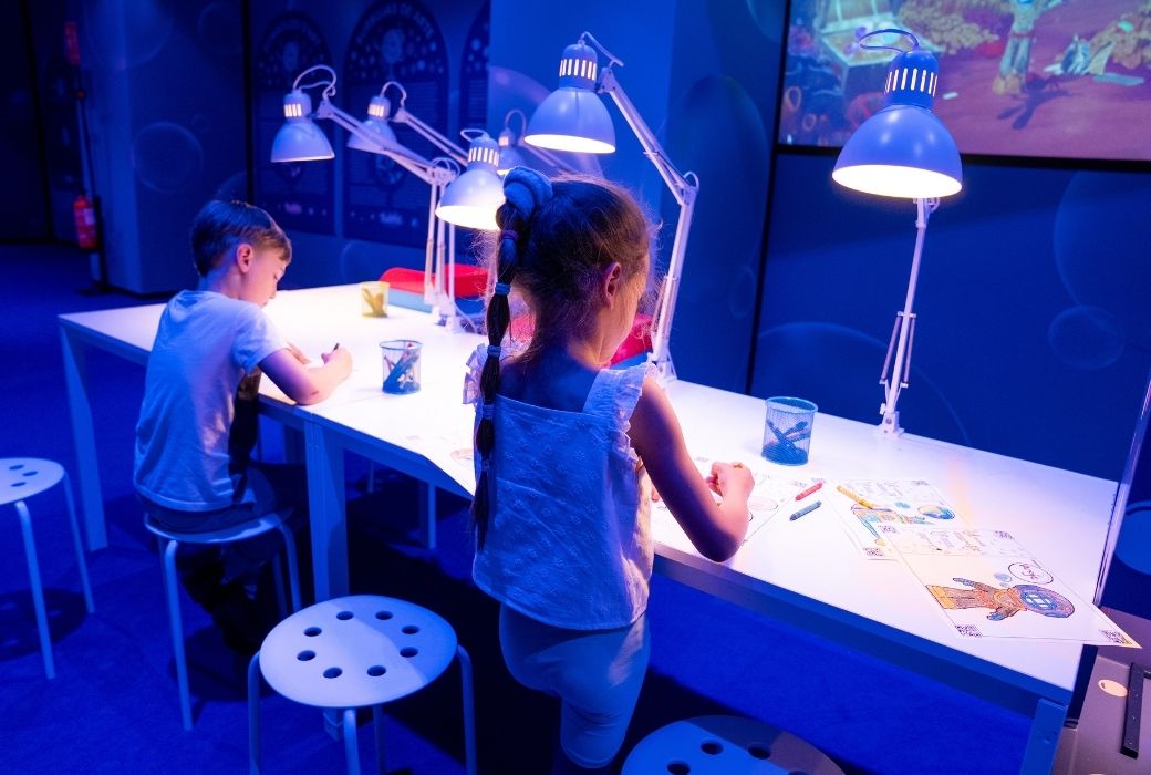 children colouring in at an art museum