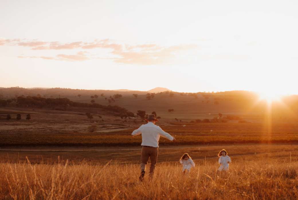 Family playing in the field at De Beaurepaire Wines
